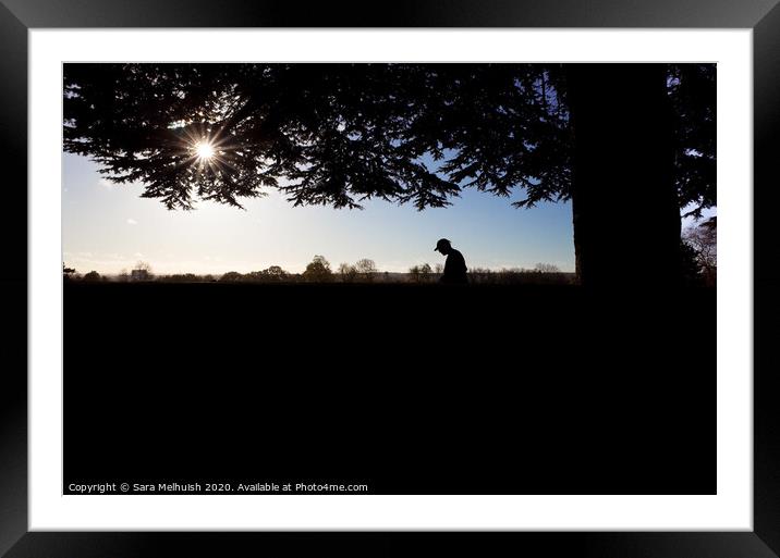 Man contemplating under a tree Framed Mounted Print by Sara Melhuish
