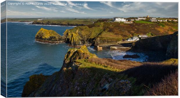 View of Mullion harbour from the cliff top Canvas Print by Paul Richards