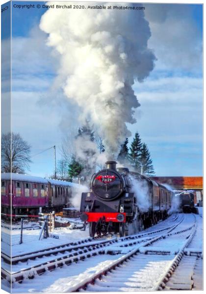 Steam locomotive 73129 in snow. Canvas Print by David Birchall