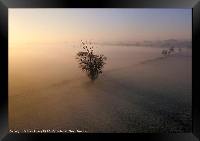 A sunrise over misty fields derbyshire Framed Print by Nick Lukey