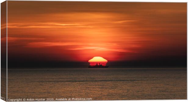 Sunrise at Sea Canvas Print by Robin Hunter