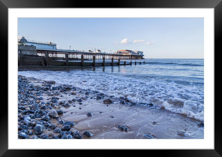 Waves lap the beach at Cromer Framed Mounted Print by Jason Wells