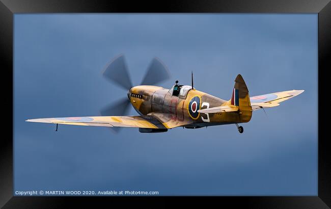 Spitfire into the Blue Framed Print by MARTIN WOOD