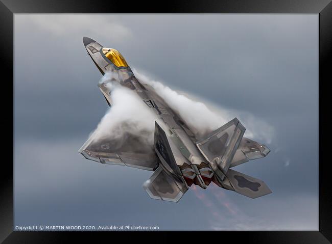 F-22 Raptor clouds Framed Print by MARTIN WOOD