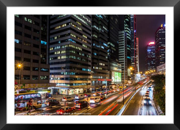Hong Kong downtown at night  Framed Mounted Print by Sergio Delle Vedove