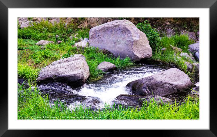 Wild creek with stones and grass Framed Mounted Print by Hanif Setiawan