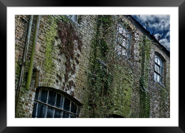 Wall at a derelict workshop in Southend on sea, Essex, UK. Framed Mounted Print by Peter Bolton