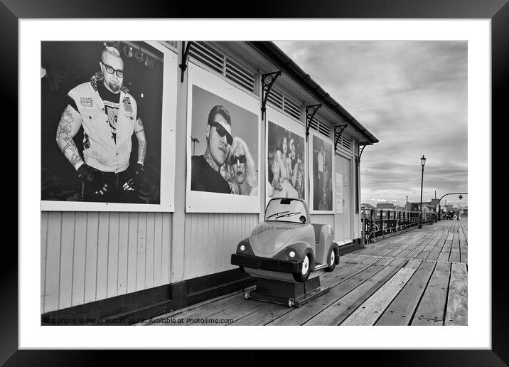 A shelter and children's coin operated ride on Southend pier, Essex, UK. Framed Mounted Print by Peter Bolton