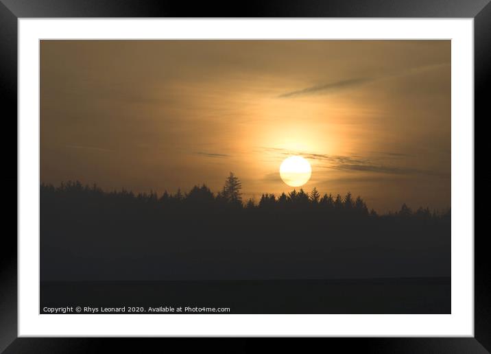 Redmires reservoirs coniferous forest slihouetted at sunset Framed Mounted Print by Rhys Leonard