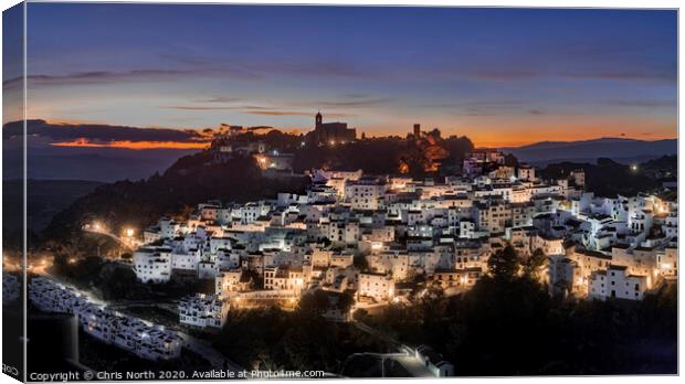 The white mountain village of Casares. Canvas Print by Chris North