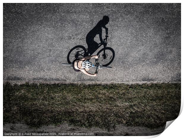 Cyclist on the road, top down image of shadow on t Print by Łukasz Szczepański