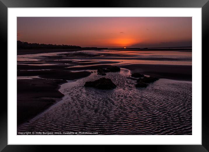 Sunset, shining over the water on the beach  Framed Mounted Print by Holly Burgess
