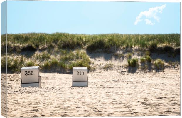 Beach chairs on the beach and grassy dunes on Sylt island Canvas Print by Daniela Simona Temneanu