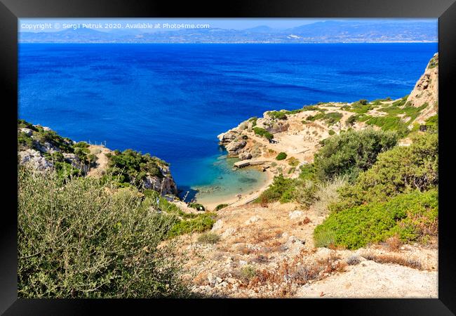 A beautiful view from a steep rocky slope on the Corinthian Gulf and the blue lagoon on the coast, a beautiful view from above. Framed Print by Sergii Petruk