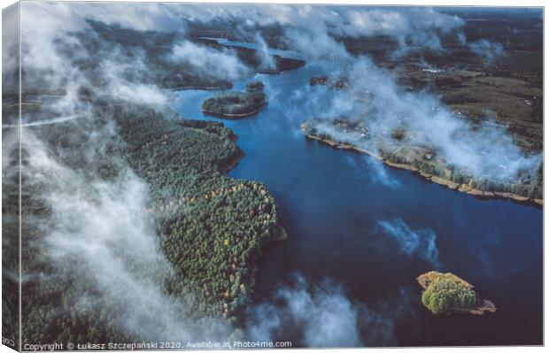 Above the clouds, aerial view of lake and forest Canvas Print by Łukasz Szczepański