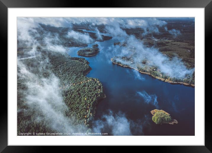 Above the clouds, aerial view of lake and forest Framed Mounted Print by Łukasz Szczepański