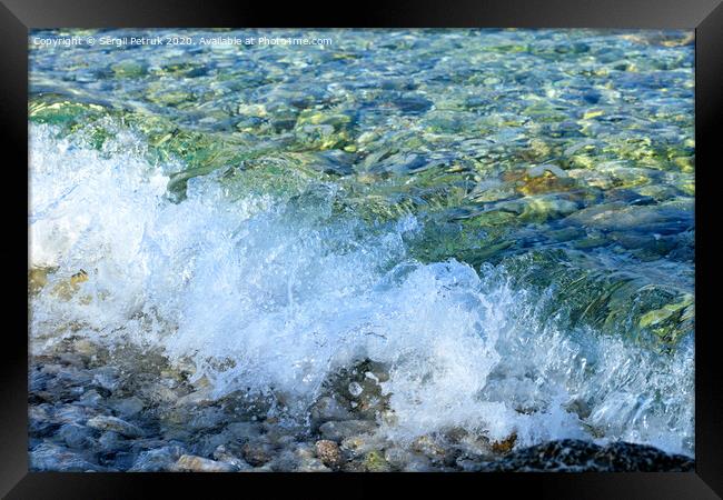 A splash of pure turquoise sea wave on pebble on the seashore. Framed Print by Sergii Petruk
