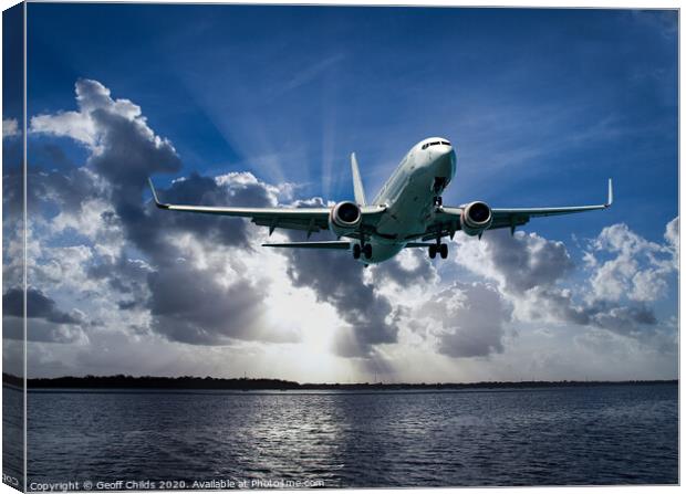 Jet Airliner Flying in subeams Canvas Print by Geoff Childs
