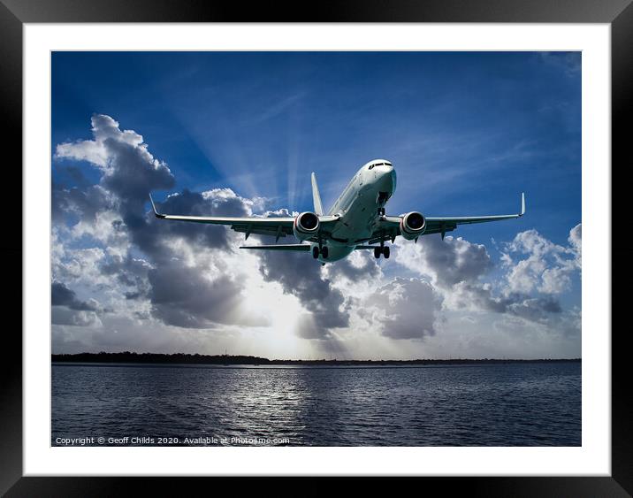 Jet Airliner Flying in subeams Framed Mounted Print by Geoff Childs