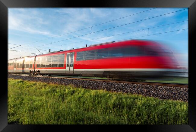 High-speed german train traveling through nature. Summer travel Framed Print by Daniela Simona Temneanu