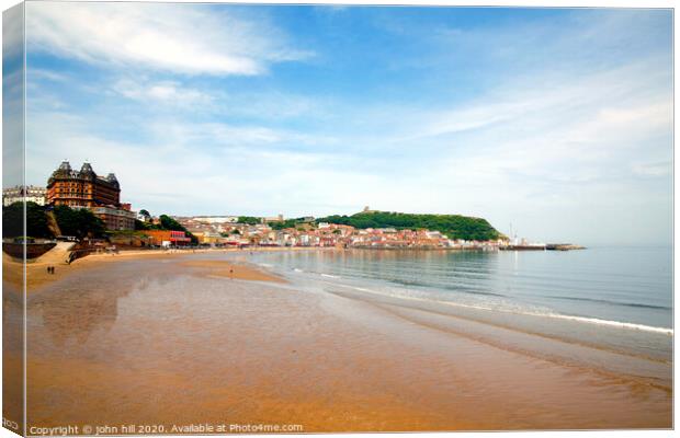 Low tide at Scarborough bay in North Yorkshire.  Canvas Print by john hill