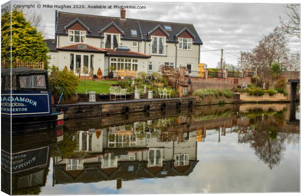 Stunning canal side home Canvas Print by Mike Hughes