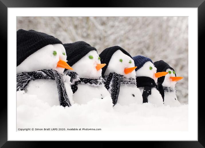 Snowmen close up in a row Framed Mounted Print by Simon Bratt LRPS