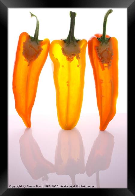 Peppers in half with light through them Framed Print by Simon Bratt LRPS
