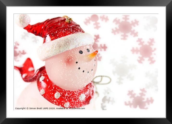 Snowman on a snowflake and white background Framed Mounted Print by Simon Bratt LRPS