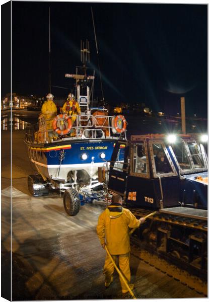 'Back from a shout'. St. Ives lifeboat returning at night. Cornwall, UK Canvas Print by Peter Bolton