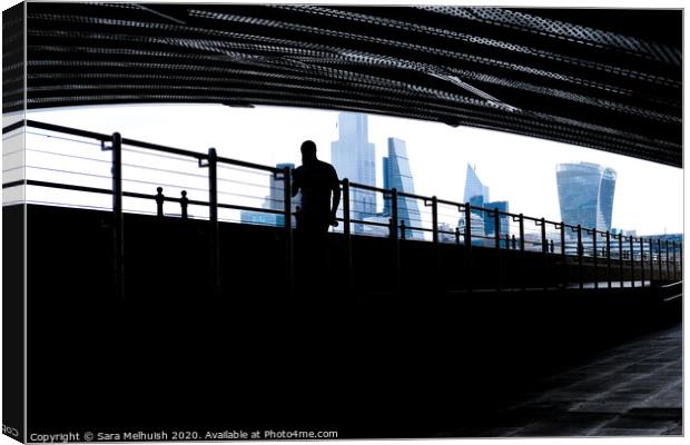 Man under the bridge Canvas Print by Sara Melhuish