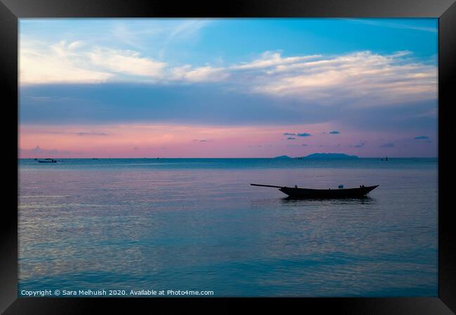 Boat at sunset Framed Print by Sara Melhuish