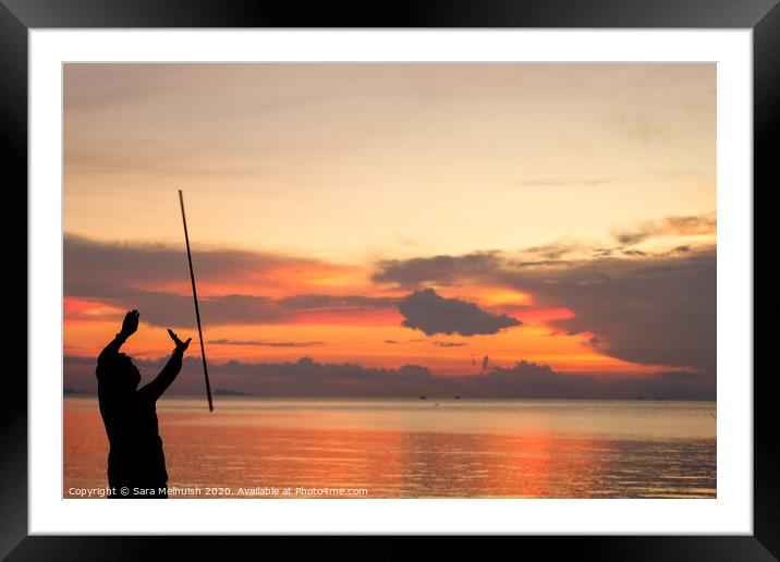 Man juggling at sunset in Thailand Framed Mounted Print by Sara Melhuish