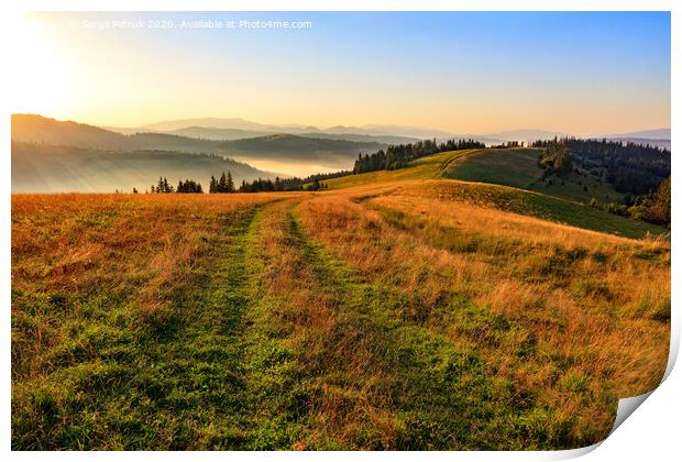 The mountain peaks of the Carpathian hills are filled with golden light in the morning sun. Print by Sergii Petruk