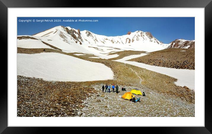 A group of tourists with tents and equipment is located at the foot of Erciyes Mountain in central Turkey, aerial view. Framed Mounted Print by Sergii Petruk