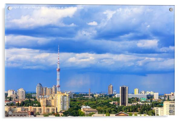 TV tower and residential areas of Kyiv at noon against the backdrop of a stormy blue summer sky. Acrylic by Sergii Petruk