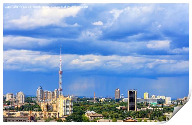 TV tower and residential areas of Kyiv at noon against the backdrop of a stormy blue summer sky. Print by Sergii Petruk