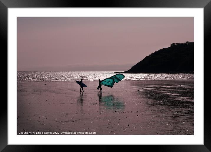 Surfer and windsurfer at Oxwich Framed Mounted Print by Linda Cooke