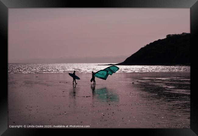 Surfer and windsurfer at Oxwich Framed Print by Linda Cooke