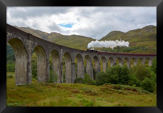 Glenfinnan Viaduct and the Jacobite Steam Train Framed Print by Derek Beattie