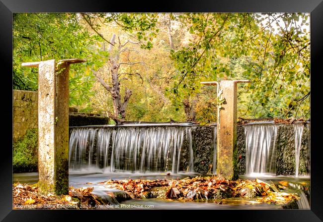 Waterfall into the lake Framed Print by Clare Edmonds