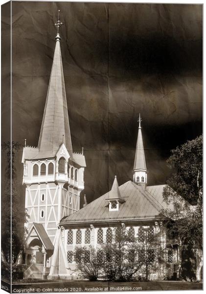 A storm building up with the wooden church at Jokkmokk Canvas Print by Colin Woods