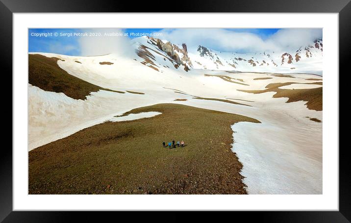 A group of tourists are at the foot of Mount Erciyes in central Turkey. Framed Mounted Print by Sergii Petruk
