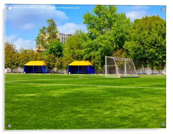 Green lawn of a soccer field with gates and tents for teams players. Acrylic by Sergii Petruk
