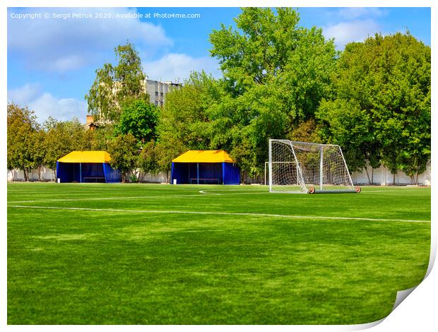 Green lawn of a soccer field with gates and tents for teams players. Print by Sergii Petruk