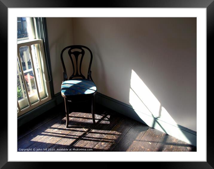 Chair in a empty room. Framed Mounted Print by john hill