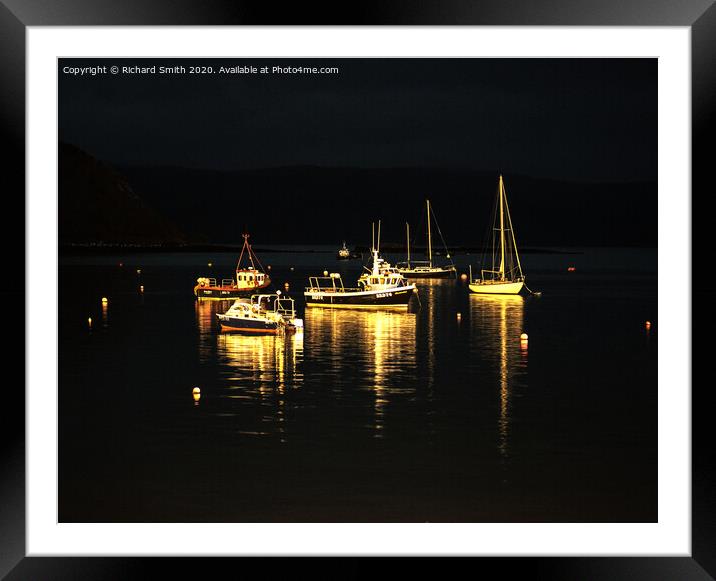 A selection of sea vessels moored in Loch Portree overnight. Framed Mounted Print by Richard Smith