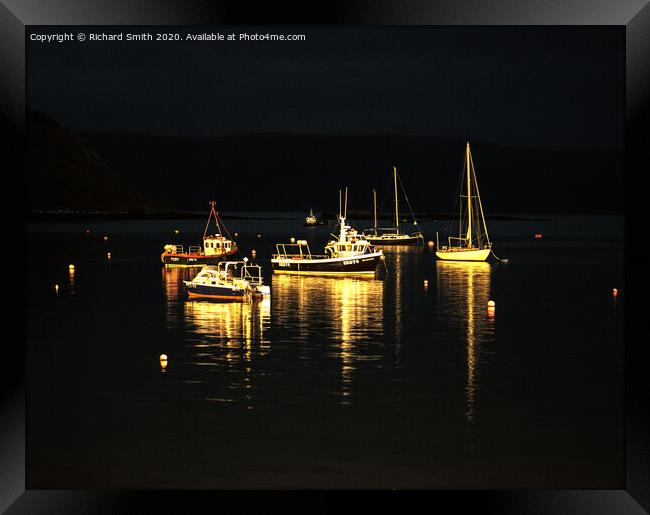 A selection of sea vessels moored in Loch Portree overnight. Framed Print by Richard Smith