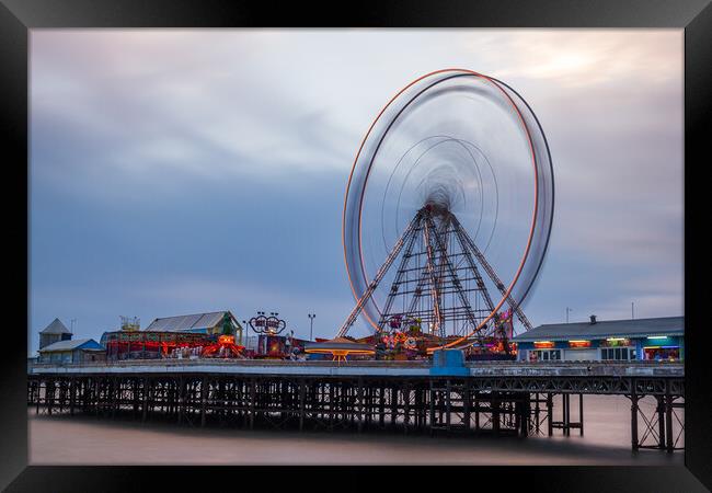 Ferris wheel spinning on Blackpool's Central Pier Framed Print by Jason Wells