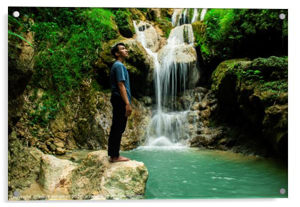 Young man enjoys the waterfall Mudal Acrylic by Hanif Setiawan